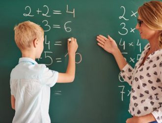 student-boy-with-chalk-chalkboard_329181-14185