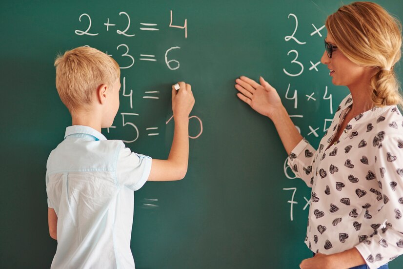 student-boy-with-chalk-chalkboard_329181-14185