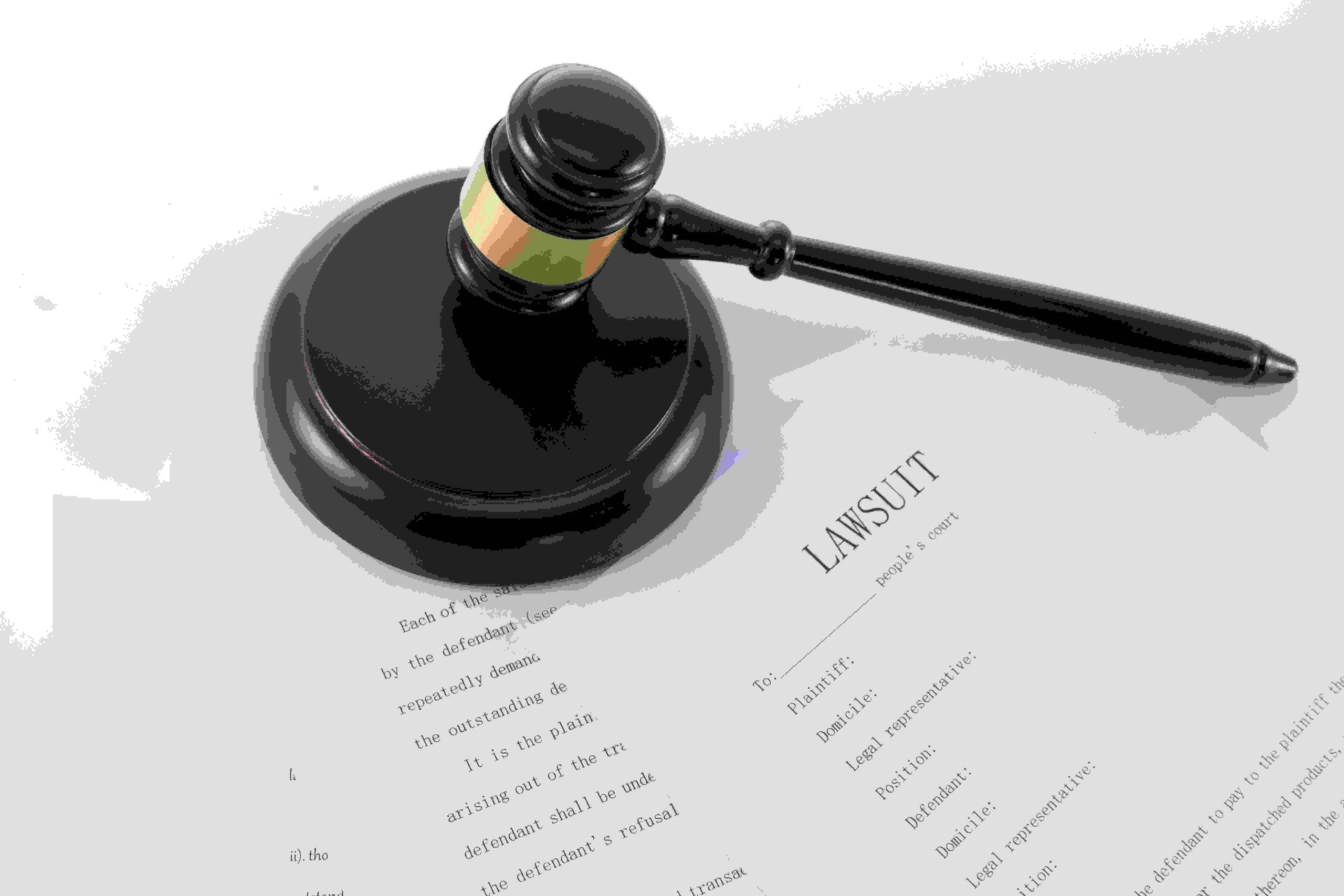 closeup-shot-judge-s-gavel-document-lawsuit (1)