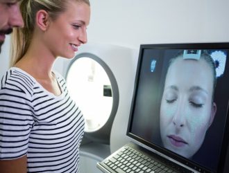 woman-looking-mri-scan-report-computer-screen_107420-74012