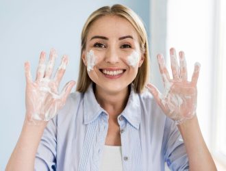 smiley-woman-washing-her-hands-with-soap_23-2148603009