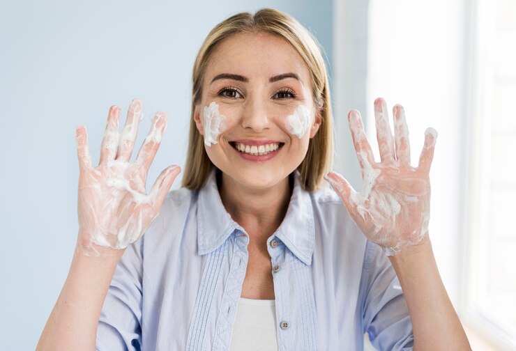 smiley-woman-washing-her-hands-with-soap_23-2148603009