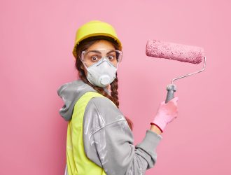 surprised-female-painter-moves-new-dwelling-busy-doing-repairing-holds-painting-roller (1)