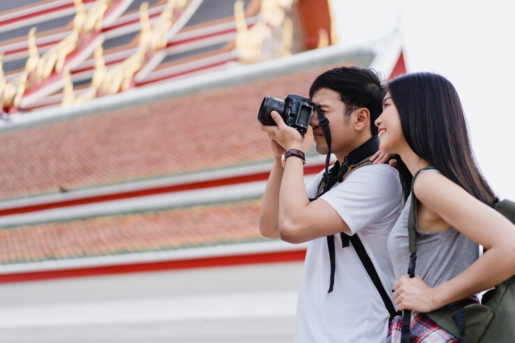 traveler-asian-couple-using-camera-take-picture-while-spending-holiday-trip-bangkok-thailand_7861-1315